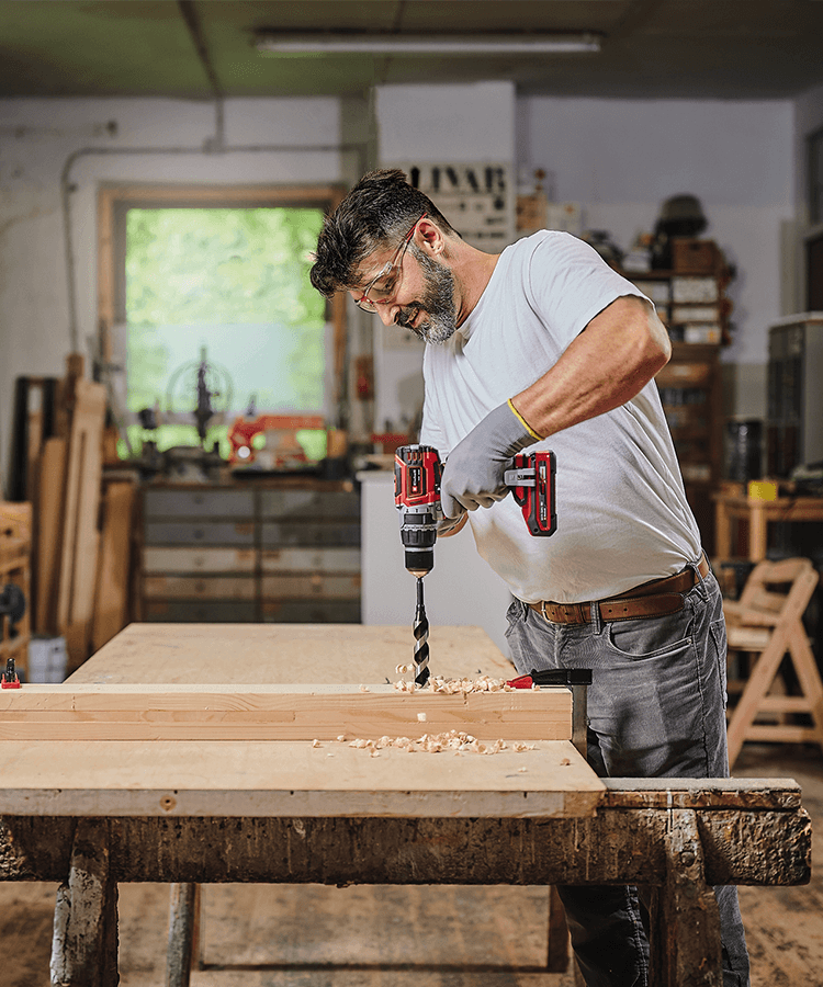 man with cordless driller