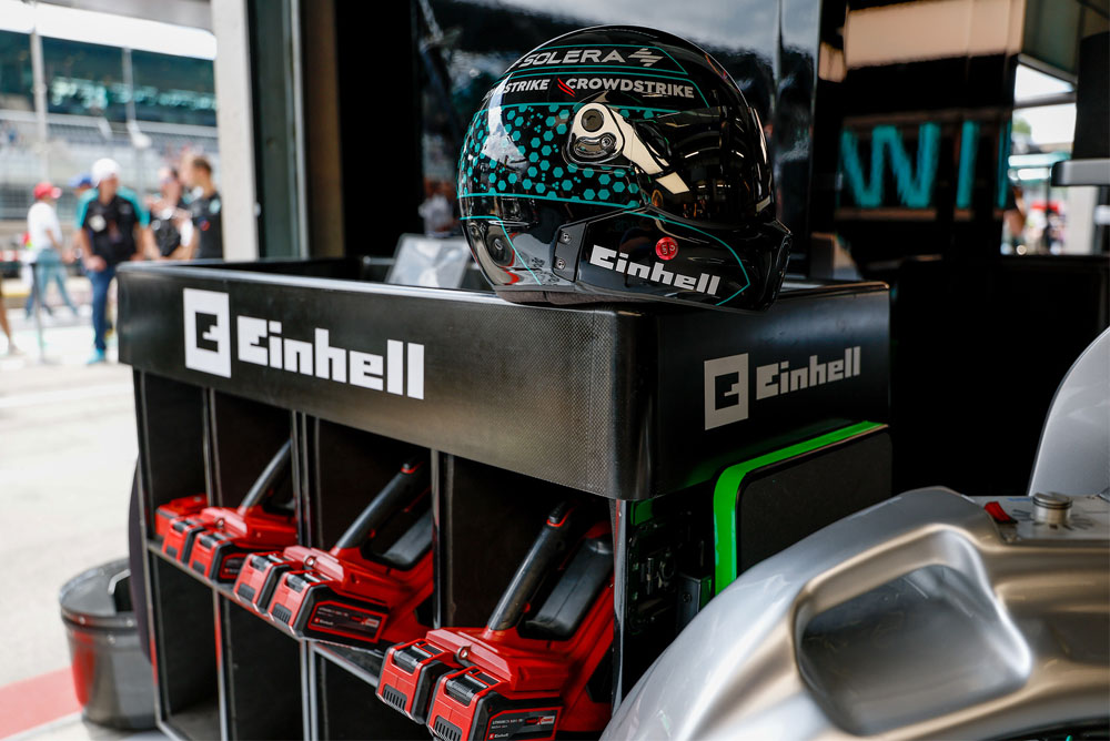 Einhell cordless tools in a trolley, with a racing helmet on top.