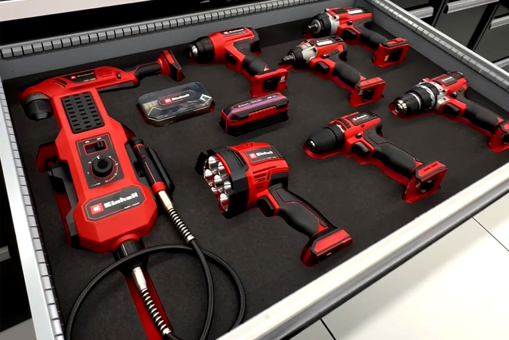 Drawer neatly organized with various Einhell cordless tools.