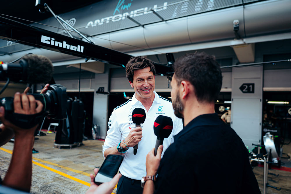 Toto Wolff getting interviewed from a reporter.