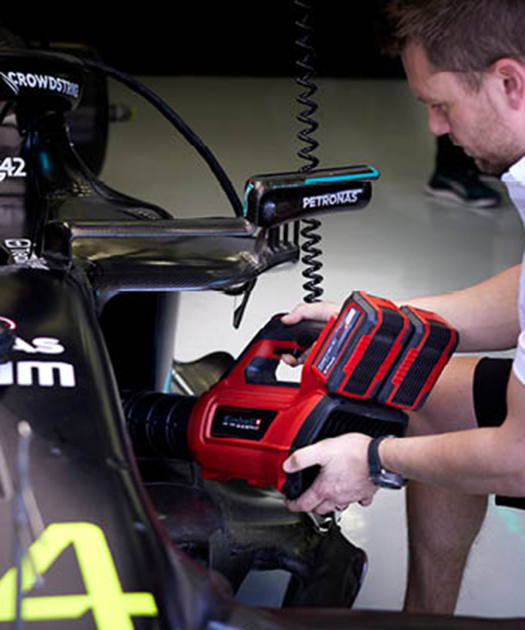 Mercedes AMG Petronas F1 Team member working with einhell tools