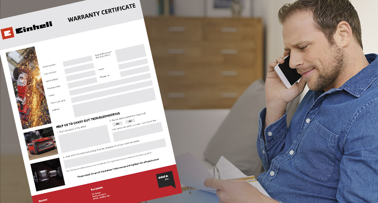 a man talks on the phone and holds a warranty certificate in his hand